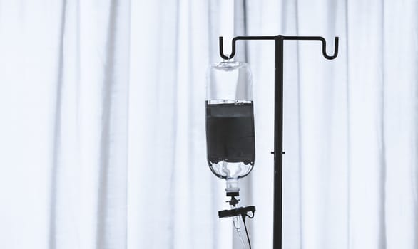 infusion bottle with white curtain background