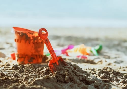 kids toys on sandy beach