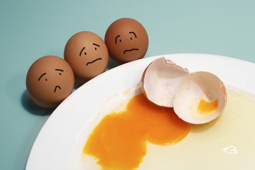 afraid emotions of eggs group and broken egg on white plate