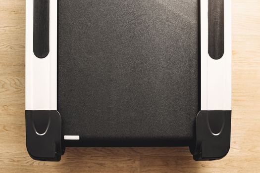 top view of treadmill on wooden floor background