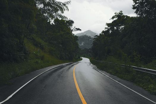 wet country road on the hill