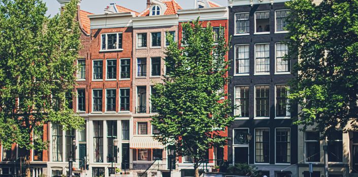 Main downtown street in the city center of Amsterdam in Netherlands on sunny day