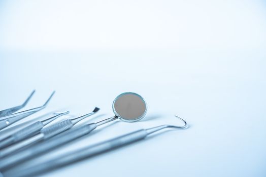  close up dentist  tools for teeth care at white background top view 