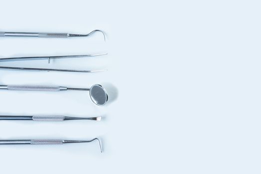  close up dentist  tools for teeth care at white background top view 