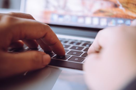 Businessman working on a laptop computer at work