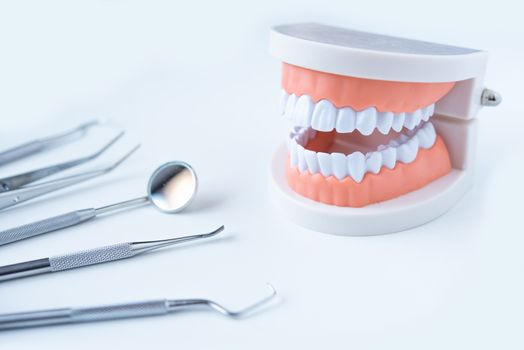  close up dentist  tools for teeth care at white background top view 