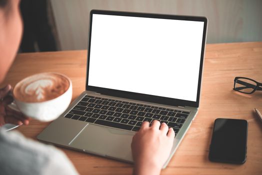 Business woman working on laptop computer in office 