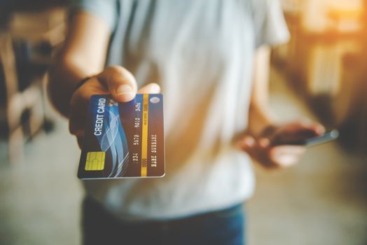 Close up of hand using credit card to pay by sending the credit card 