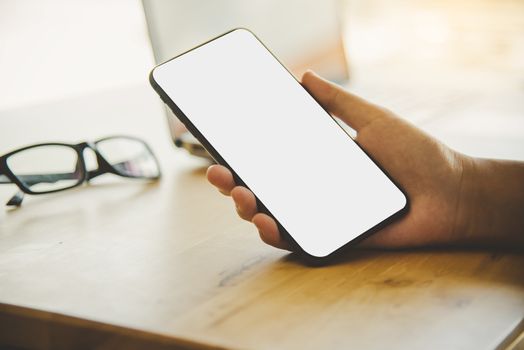 hands business holding blank screen mobile in desk work.