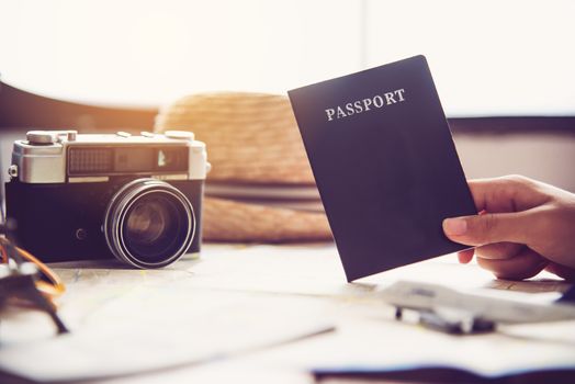 People holding passports, map for travel with luggage for the trip 