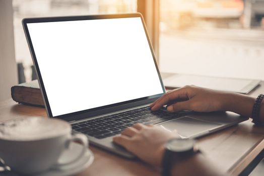 Business woman working on laptop computer in office 