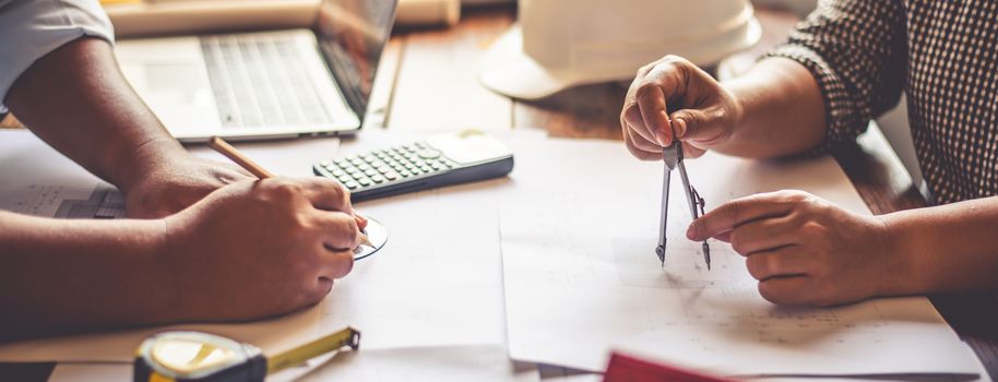 Team of engineers working together in a architect office.
