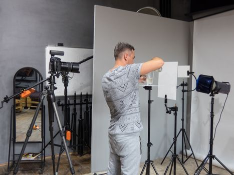 a young photographer is prepared for photography in the studio. unintended photography