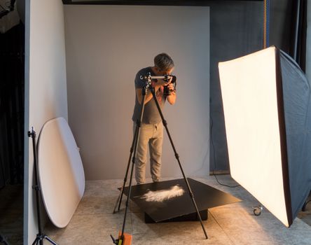 photographer working in the studio. unintended photography