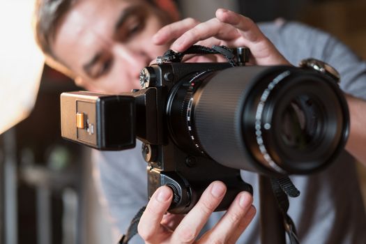 close-up camera with flash on the background of the photographer