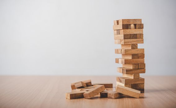 game drew to a wooden block from the tower.concept  business risks in the business. Requires planning meditation must be careful in deciding to reduce the risk in the business. 