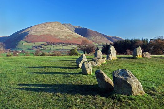 Castlerigg Stone Circle is situated near Keswick, Cumbria in the English Lake District national park.  Blencathra, one of the highest peaks in Cumbria, is in the background.