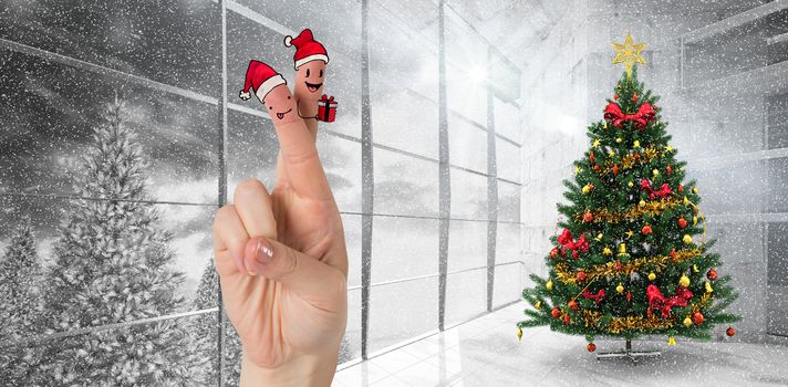 Christmas fingers against home with christmas tree