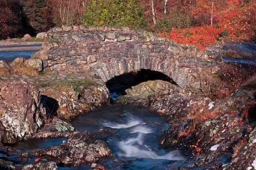 Ashness bridge is a picturesque humped backed bridge crosses Barrow Beck and is a landmark close to Derwentwater in the English Lake District national park.