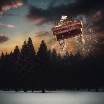 Santa flying his sleigh against fir tree forest in snowy landscape