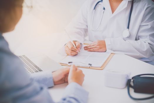 The doctor is discussing with the patient after a physical examination of the results and treatment 