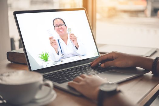 The patient's viewpoint consult with the doctor via social media such as laptop, smartphone, almost. The work for home concept of doctors and patients.