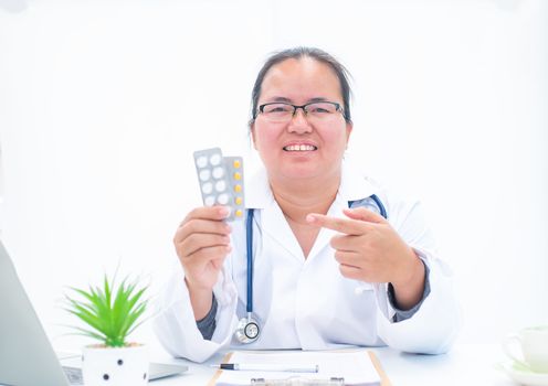 Portrait of a female doctor on a white background giving knowledge about drug use