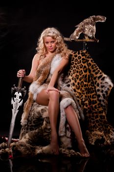 Young beautiful naked woman in fur