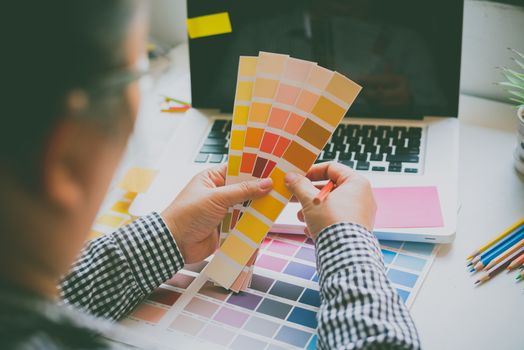 

The graphic designer creative team is currently working on the design and color selection on the guide color for advertising design.