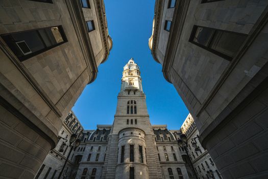 Uprisen angle of Philadelphia city hall with historic building over blue sky background, Pennsylvania, USA or United States of America, Architecture and building, Travel and Tourism concept