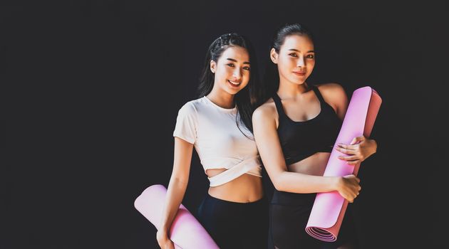 Portrait Couple sporty asian woman standing and smiling, wearing sportswear bra and pants fashion, posture position, sport club community, sports and healthcare concept