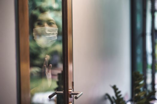 Asian woman wearing medical mask stay isolation at home for self quarantine in  Covid-19 outbreak situation, coronavirus pandemic and lockdown, Social distancing and responsibility, new normal concept