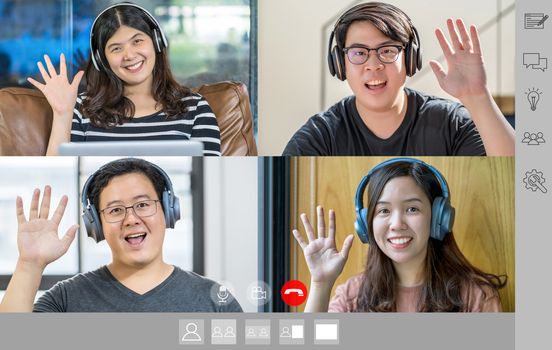 Asian Business people saying hello with teamwork colleague in video call conference screen when Covid-19 pandemic, Coronavirus outbreak, online meeting, Social distancing and new normal concept
