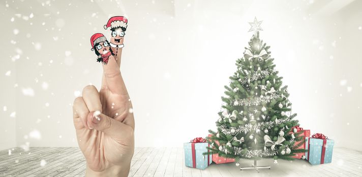 Christmas fingers against home with christmas tree