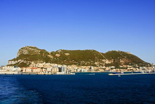 Gibraltar is a British territory located to the south of the Iberian Peninsula at the entrance to the Mediterranean Sea.  The land is one of the most southerly points in Europe.