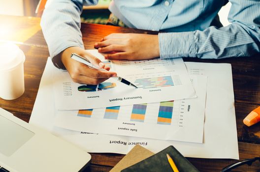 Top view process close-up analyzing investment chart working in office. Business work concept. discussing on stock market charts in office.
