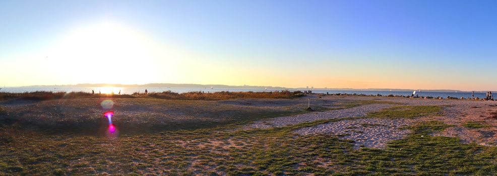 Beautiful high resolution panorama of a northern european country landscape with fields and green grass.