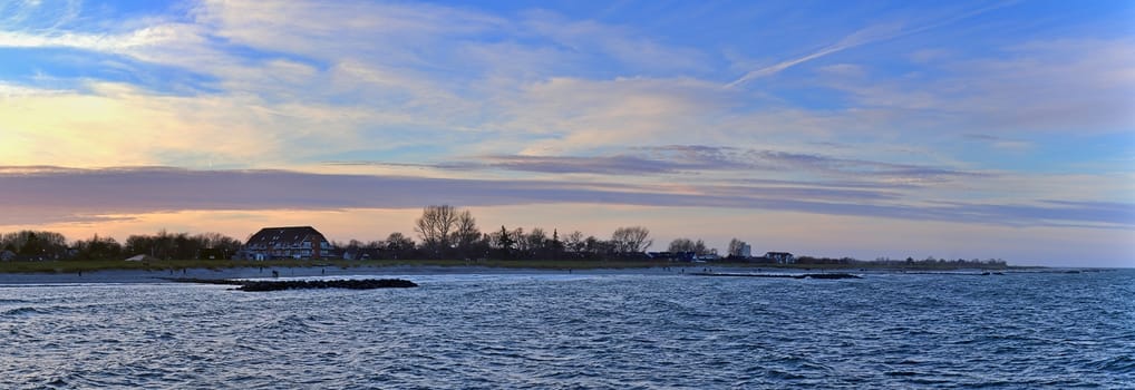 Beautiful high resolution panorama of a northern european country landscape with fields and green grass.