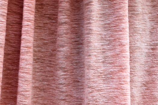 Detailed close up view on samples of cloth and fabrics in different colors found at a fabrics market.