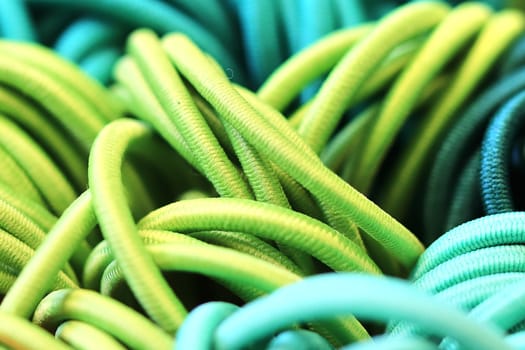 Detailed close up view on samples of cloth and fabrics in different colors found at a fabrics market.