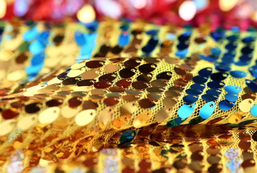 Detailed close up view on samples of cloth and fabrics in different colors found at a fabrics market.