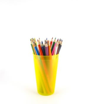 Color pencils in the yellow prop over white 