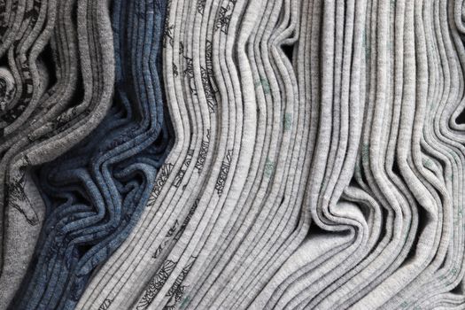 Detailed close up view on samples of cloth and fabrics in different colors found at a fabrics market.