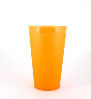 Orange plastic cup over white