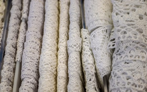 Detailed close up view on samples of cloth and fabrics in different colors found at a fabrics market.