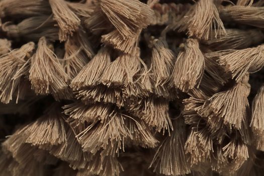 Detailed close up view on samples of cloth and fabrics in different colors found at a fabrics market.