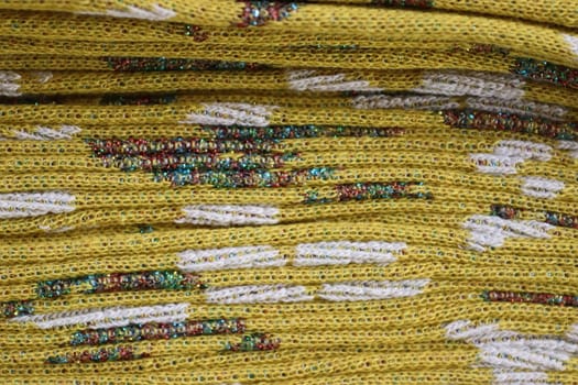 Detailed close up view on samples of cloth and fabrics in different colors found at a fabrics market.