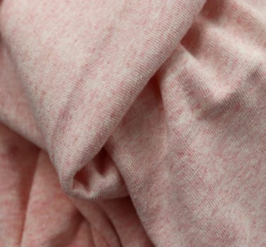 Detailed close up view on samples of cloth and fabrics in different colors found at a fabrics market.