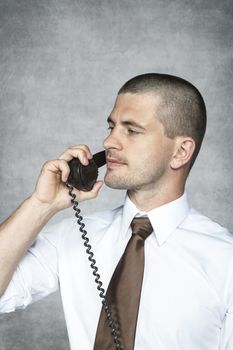 serious businessman talking on the phone