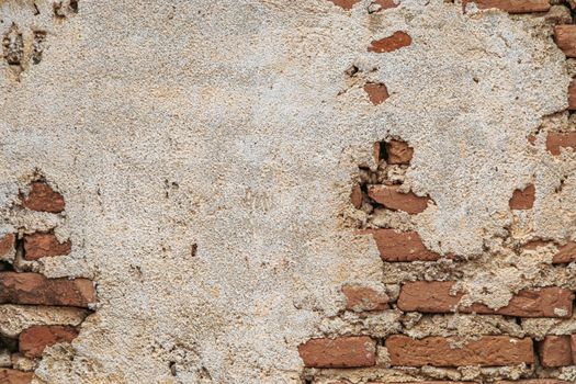 Brick wall with cement cracked for background